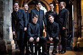The Gesualdo Six choir wearing matching black suits