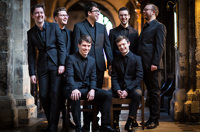 The Gesualdo Six choir wearing matching black suits